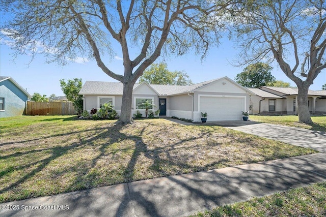 ranch-style home featuring a garage, driveway, a front yard, and fence