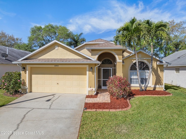 4983 Erin Ln, Melbourne, FL 32940 - view of front facade with a front yard, a garage, driveway, and stucco siding