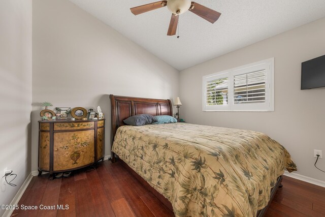 4983 Erin Ln, Melbourne, FL 32940 - bedroom with a ceiling fan, lofted ceiling, dark wood-style floors, and baseboards