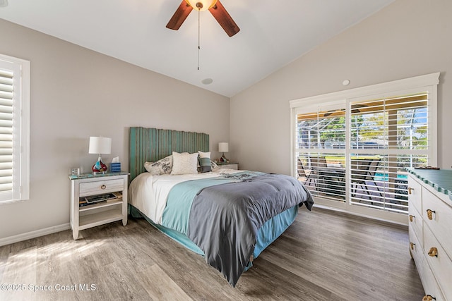 4983 Erin Ln, Melbourne, FL 32940 - bedroom with a ceiling fan, lofted ceiling, wood finished floors, and baseboards