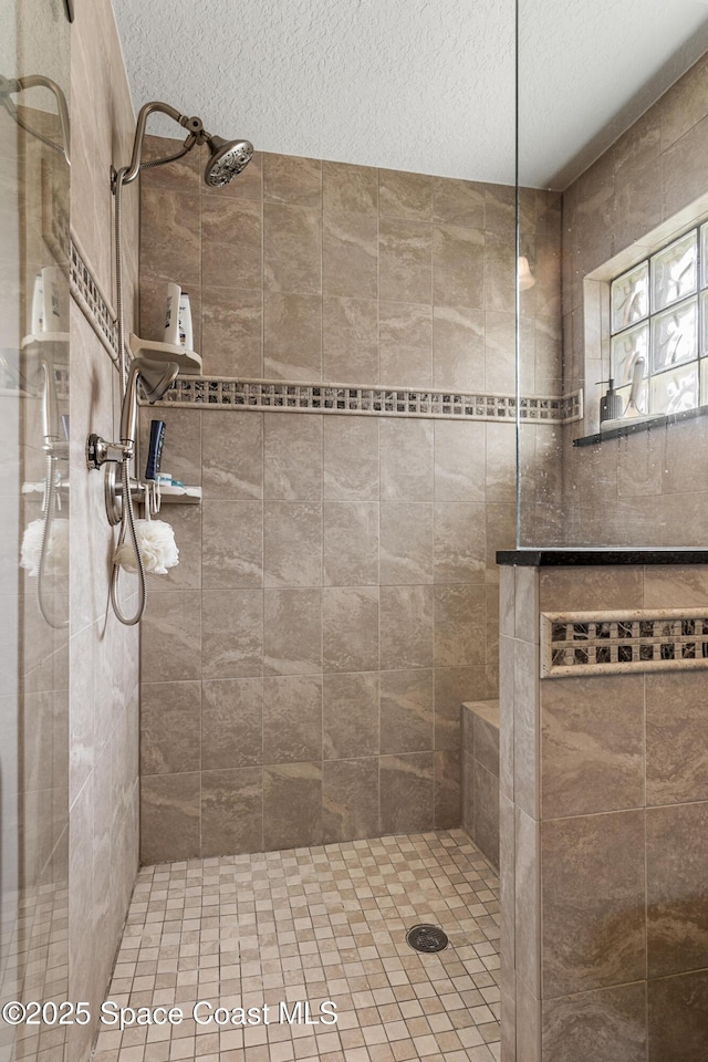 4983 Erin Ln, Melbourne, FL 32940 - full bath featuring a textured ceiling and walk in shower