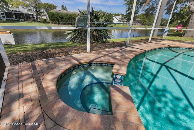 4983 Erin Ln, Melbourne, FL 32940 - outdoor pool featuring glass enclosure, an in ground hot tub, and a water view