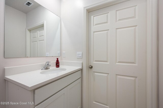 bathroom with visible vents and vanity