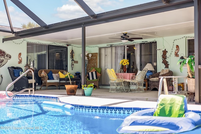 outdoor pool featuring an outdoor hangout area, ceiling fan, and a lanai