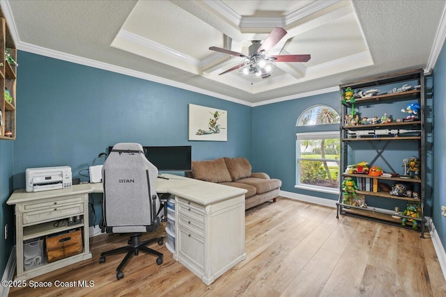 office featuring light wood-type flooring, a textured ceiling, coffered ceiling, and crown molding