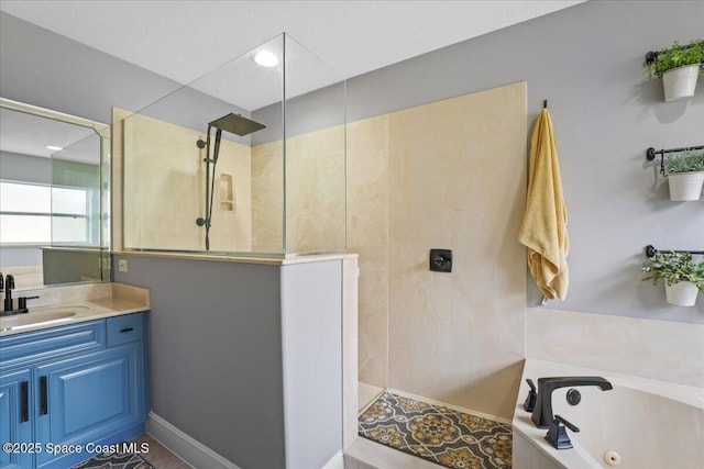 full bathroom featuring a jetted tub, vanity, and a walk in shower