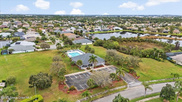 bird's eye view featuring a water view and a residential view