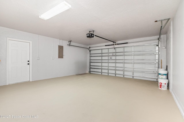 garage with electric panel and a garage door opener