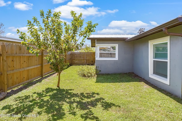 view of yard with a fenced backyard