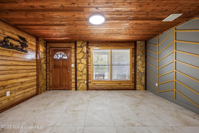 foyer with wood ceiling and visible vents