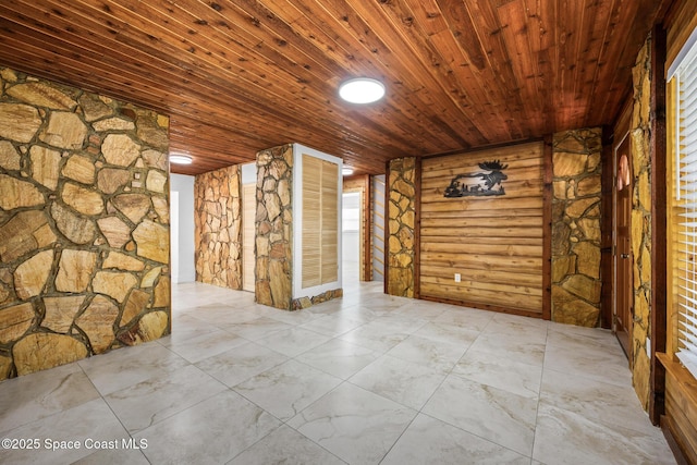 unfurnished room with wood ceiling