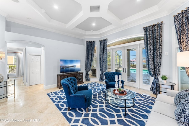 living room with french doors, arched walkways, coffered ceiling, and crown molding