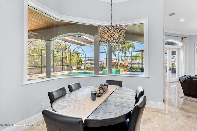 dining area with marble finish floor, recessed lighting, crown molding, a sunroom, and baseboards