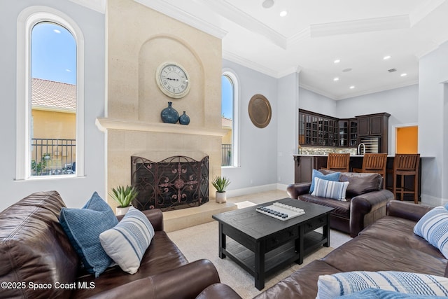 living area with plenty of natural light, baseboards, and a premium fireplace