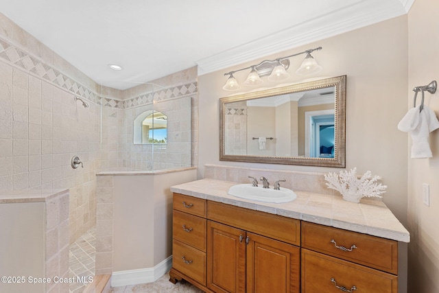 full bathroom featuring vanity, walk in shower, and ornamental molding