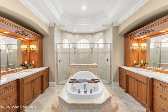 bathroom with a shower stall, a garden tub, visible vents, and ornamental molding