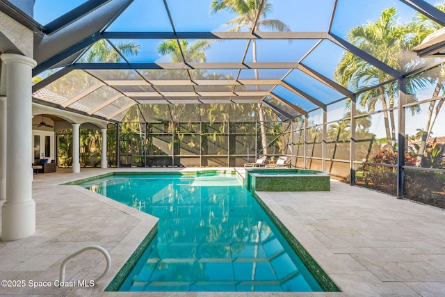 view of swimming pool with a patio, a ceiling fan, and a lanai