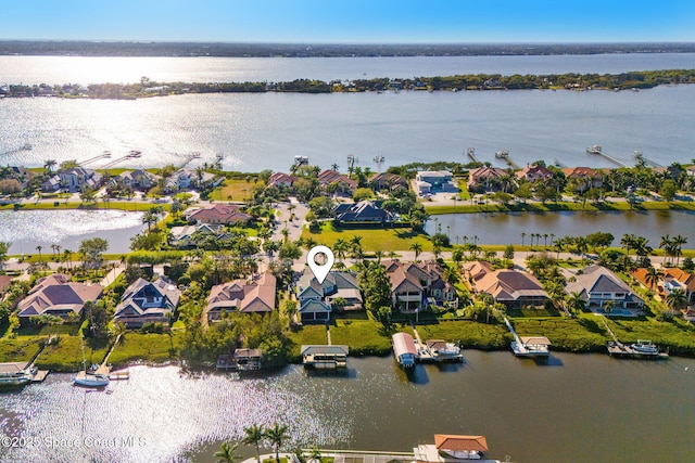 aerial view featuring a residential view and a water view