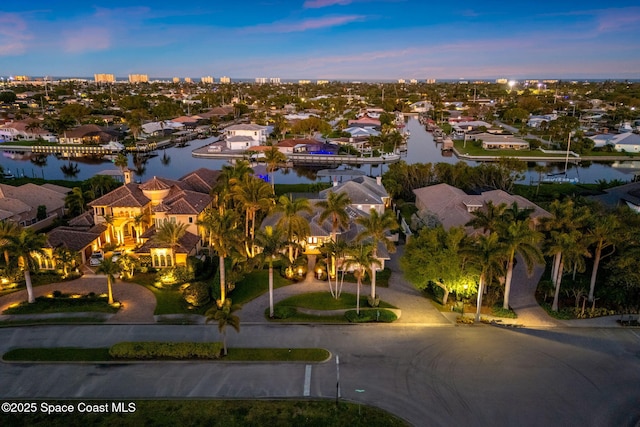 bird's eye view with a residential view and a water view