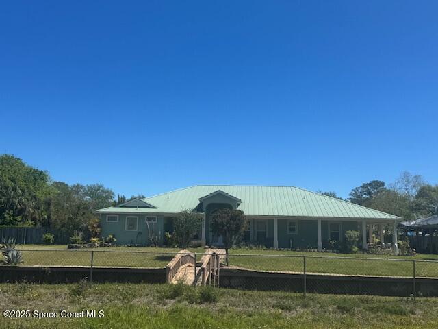 4245 Hartville Ave, Cocoa, FL 32926 - back of house with metal roof