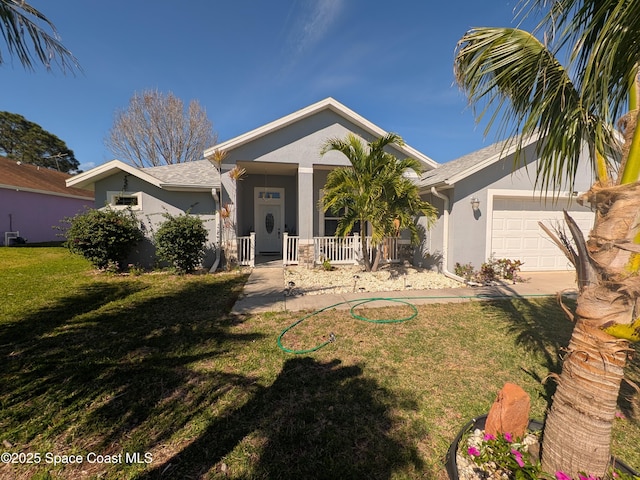 view of front facade with an attached garage, covered porch, a front yard, and stucco siding