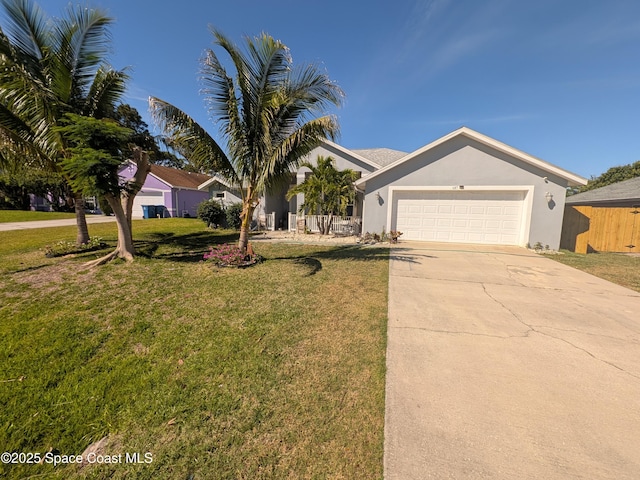 ranch-style house featuring a garage, stucco siding, concrete driveway, and a front yard