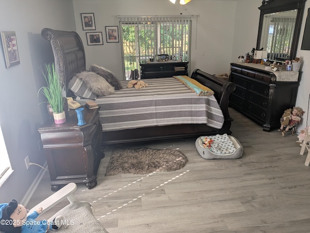 bedroom featuring wood finished floors