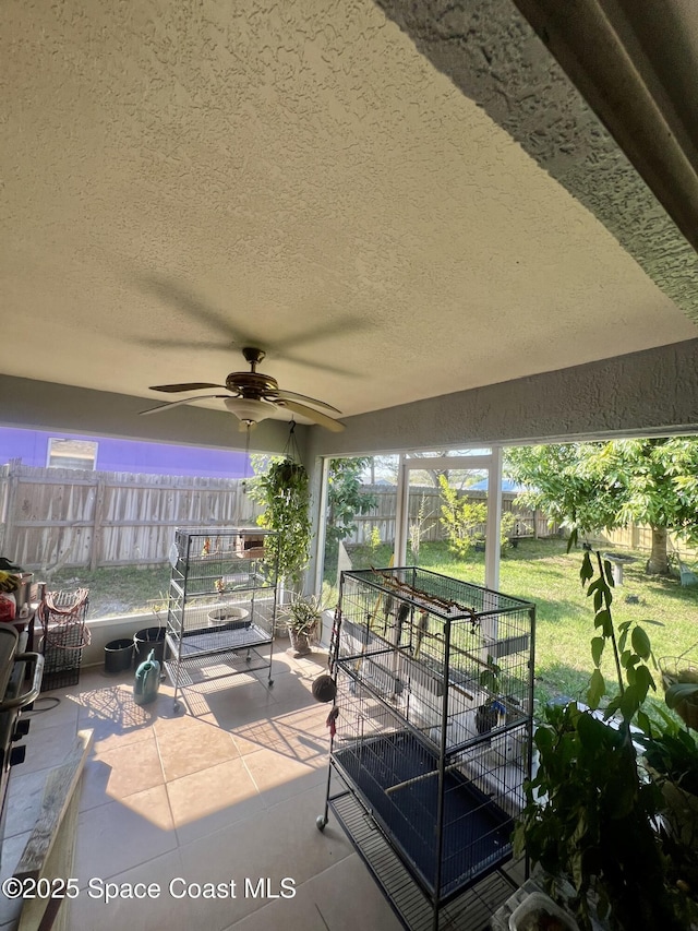 view of patio / terrace featuring fence and ceiling fan