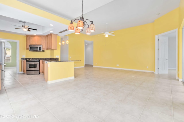 kitchen with recessed lighting, appliances with stainless steel finishes, open floor plan, baseboards, and ceiling fan with notable chandelier