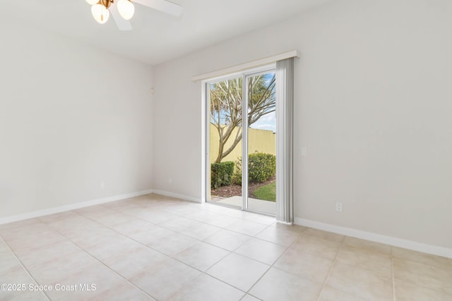 unfurnished room with a ceiling fan, baseboards, and light tile patterned floors