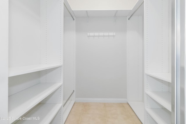 walk in closet featuring light tile patterned floors