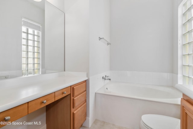 full bath with a bath, toilet, a wealth of natural light, and vanity