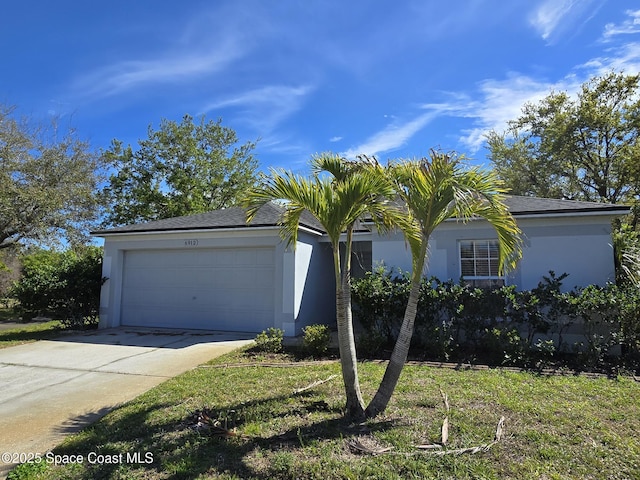 view of front of property with a garage, driveway, and stucco siding