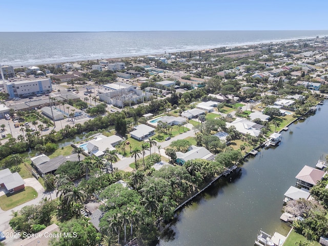 112 Sunset Dr, Cocoa Beach, FL 32931 - aerial overview of property's location with a large body of water and nearby suburban area