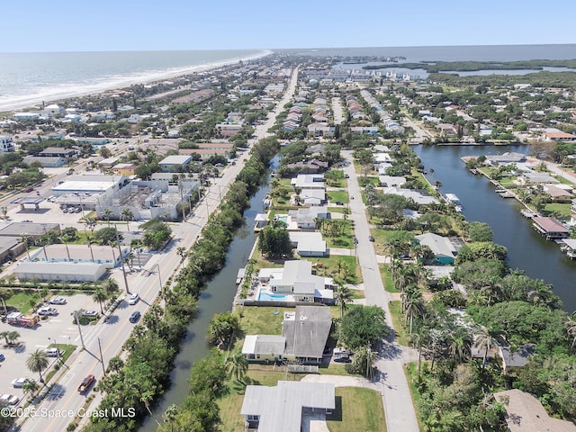 112 Sunset Dr, Cocoa Beach, FL 32931 - aerial view of property's location with a large body of water and nearby suburban area