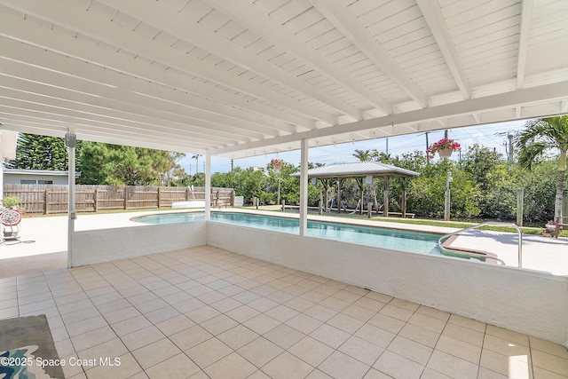 112 Sunset Dr, Cocoa Beach, FL 32931 - view of swimming pool featuring a gazebo, a patio area, and fence