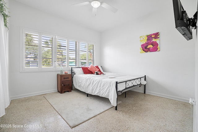 112 Sunset Dr, Cocoa Beach, FL 32931 - bedroom featuring speckle patterned floor, baseboards, and a ceiling fan