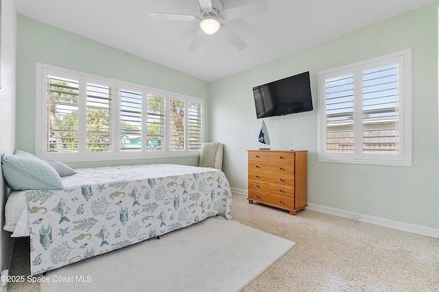 112 Sunset Dr, Cocoa Beach, FL 32931 - bedroom featuring baseboards and a ceiling fan