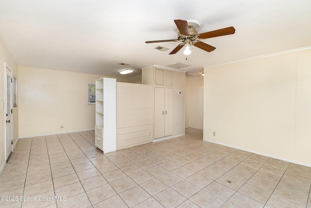 spare room featuring visible vents, baseboards, ceiling fan, and light tile patterned flooring