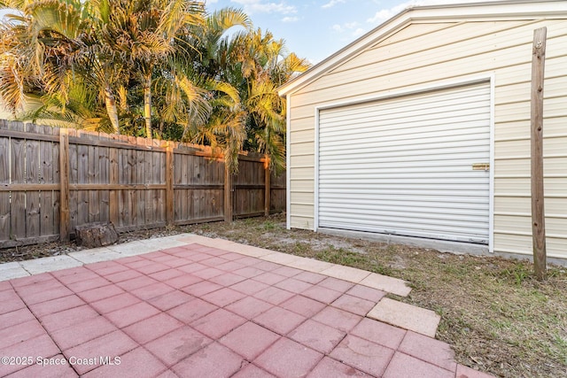 garage with fence