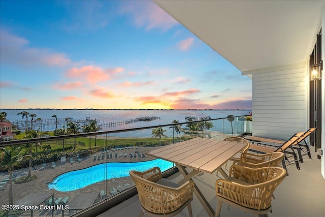 balcony featuring a water view