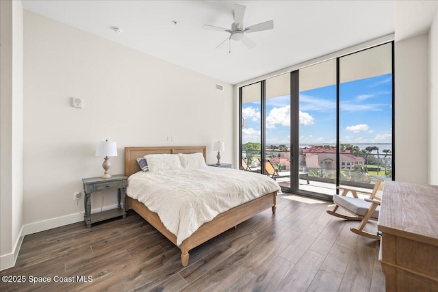 225 Strand Dr Unit 401, Melbourne Beach, FL 32951 - bedroom with access to exterior, baseboards, floor to ceiling windows, wood finished floors, and a ceiling fan