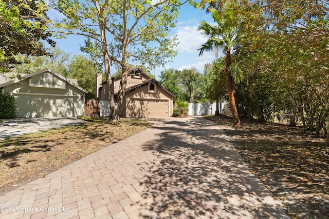 view of front of home featuring fence