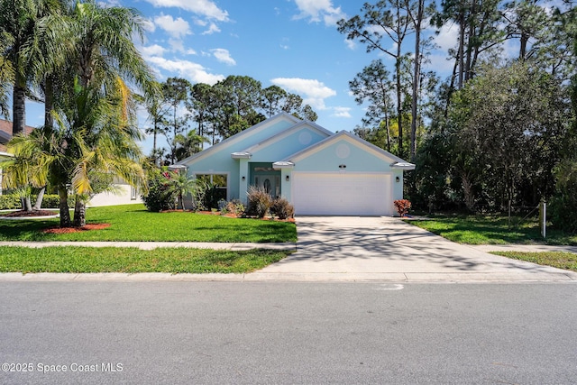 view of front of home with a garage, stucco siding, driveway, and a front yard