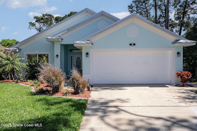 ranch-style home featuring driveway, a front lawn, an attached garage, and stucco siding