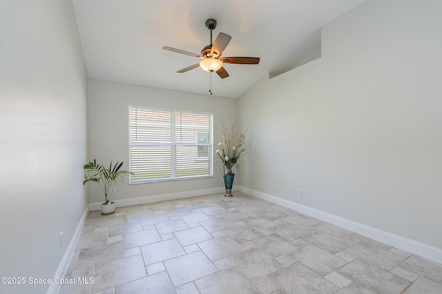 unfurnished room with ceiling fan, lofted ceiling, and baseboards