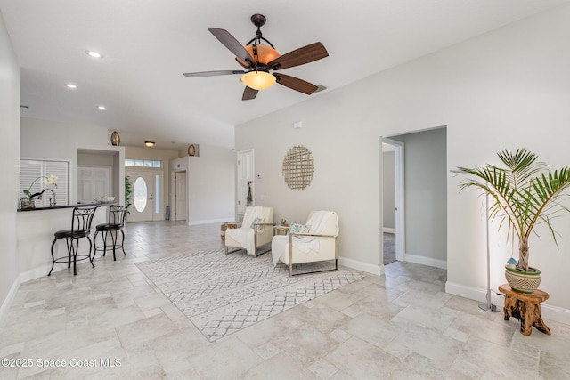 living area featuring ceiling fan, recessed lighting, and baseboards