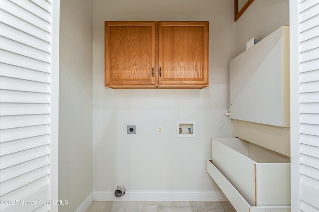 clothes washing area featuring hookup for a washing machine, hookup for an electric dryer, cabinet space, and baseboards