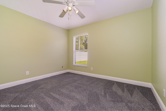 unfurnished room with dark carpet, baseboards, and ceiling fan