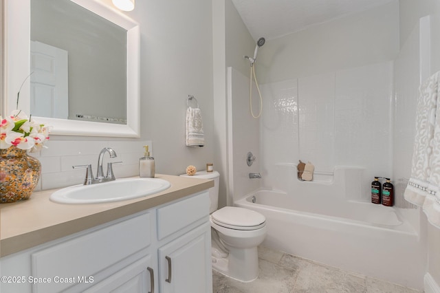 full bath featuring toilet, tub / shower combination, backsplash, and vanity